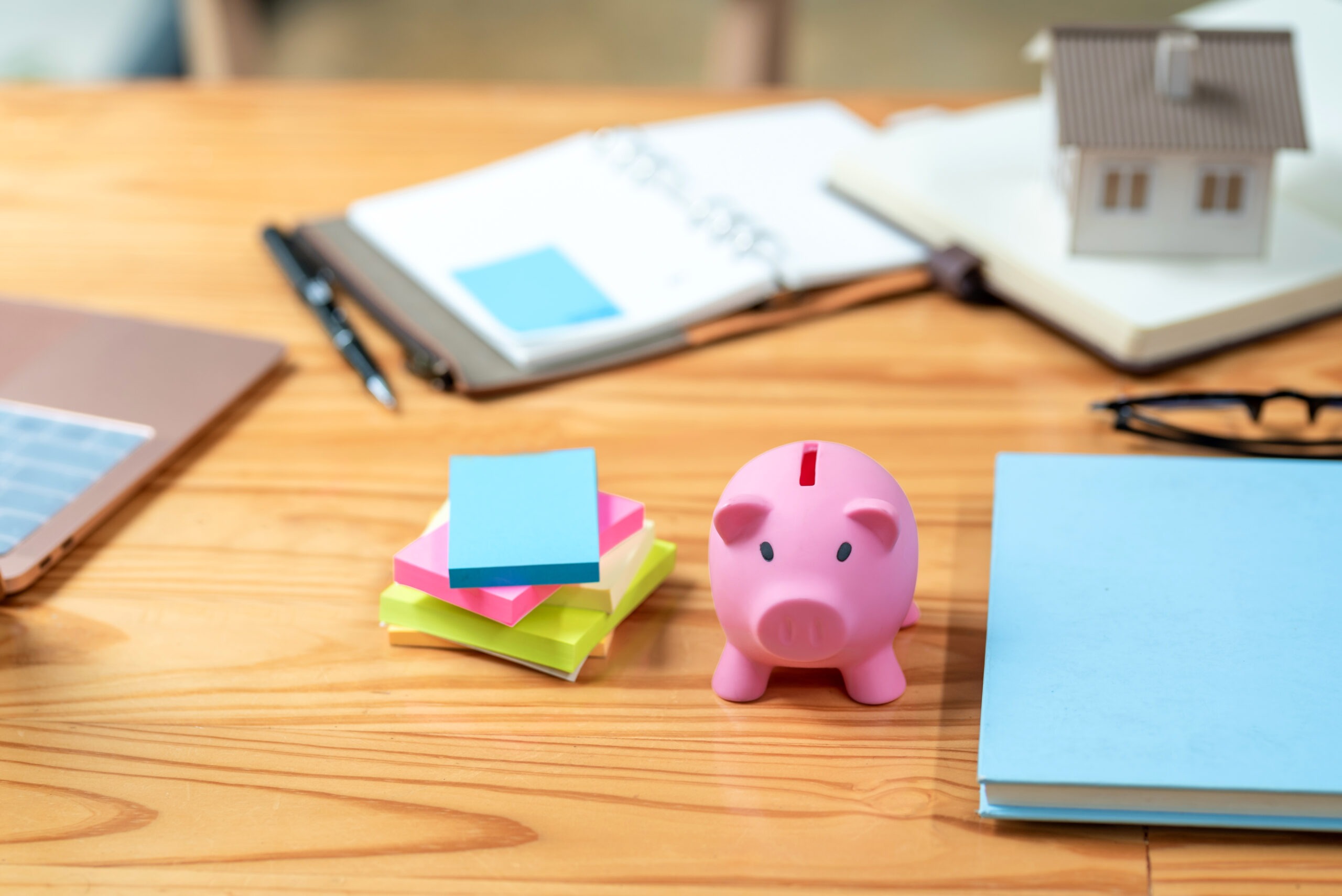 Equipment work placed on a wooden office table real estate working ideas.