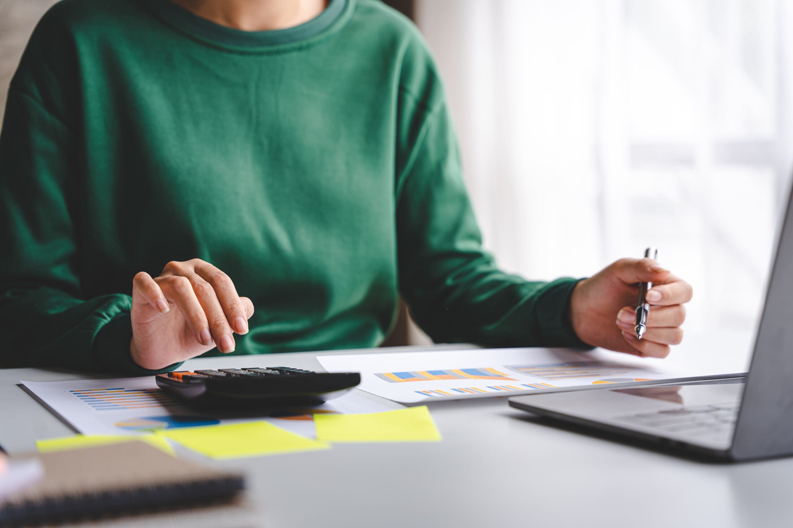 Portrait of a woman working on a tablet computer in a modern office. Make an account analysis report. real estate investment information financial and tax system concepts